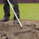 Lee using the Liteweight Soil Rake